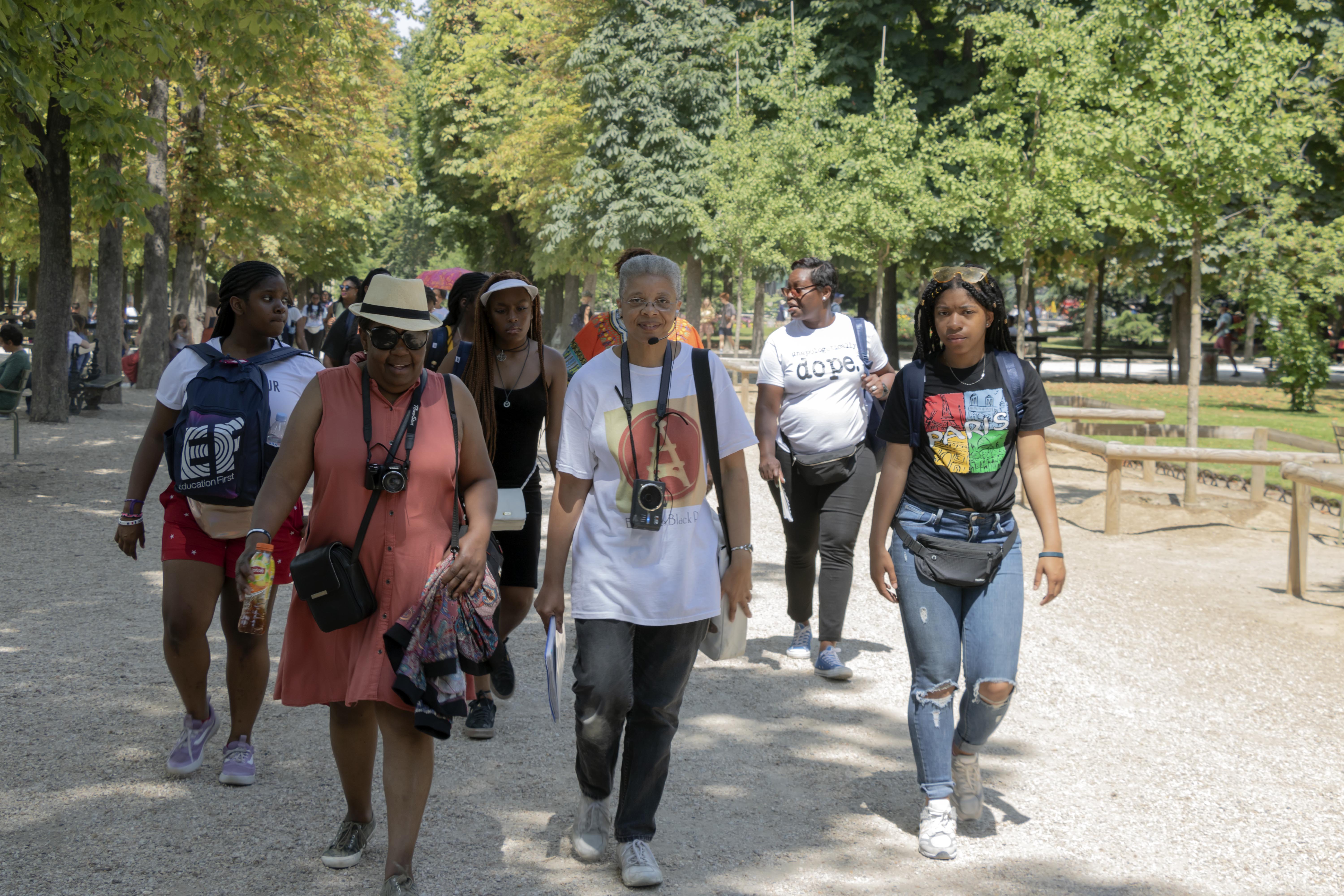 Monique leading student group through the Luxembourg Garden